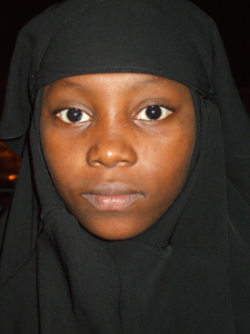 Just a beautiful girl in black headscarf and burqa